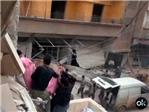 Un helicptero deja caer varias bombas de barril sobre un barrio de Damasco