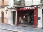 Tres atracadores asaltan a punta de pistola una pizzería en la calle Santa Teresa de Alzira